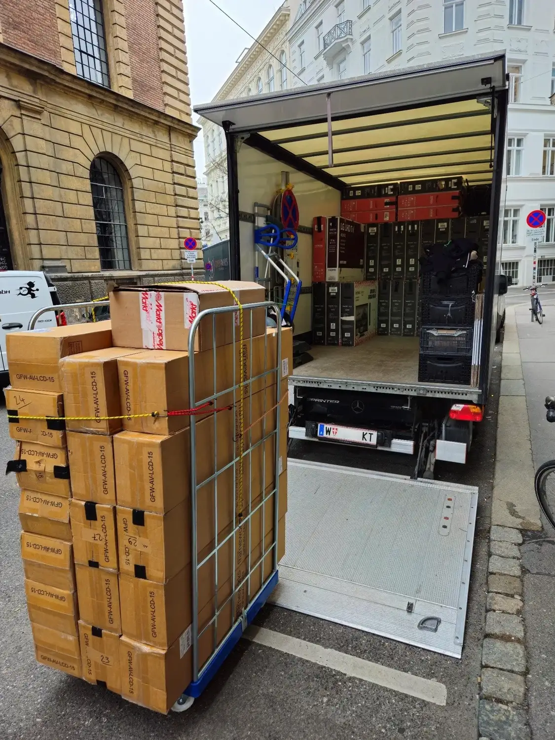 FlexiTrans truck with tail lift during an office move in Vienna