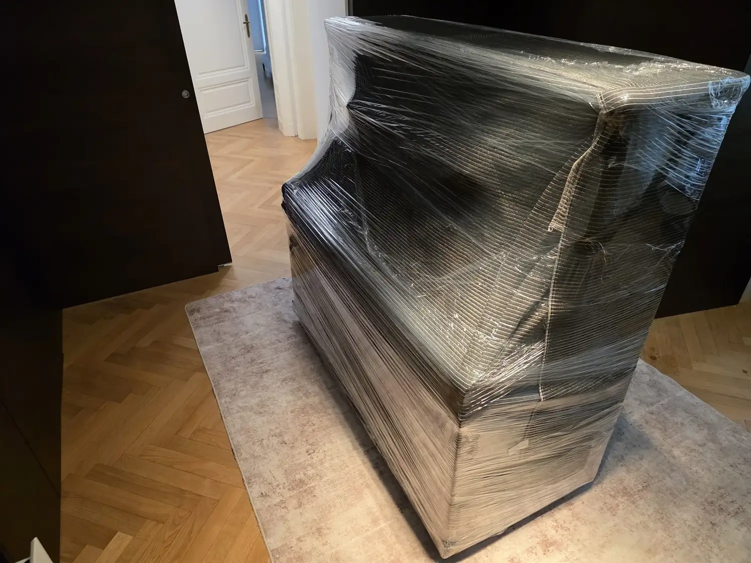 Upright piano packed for transport